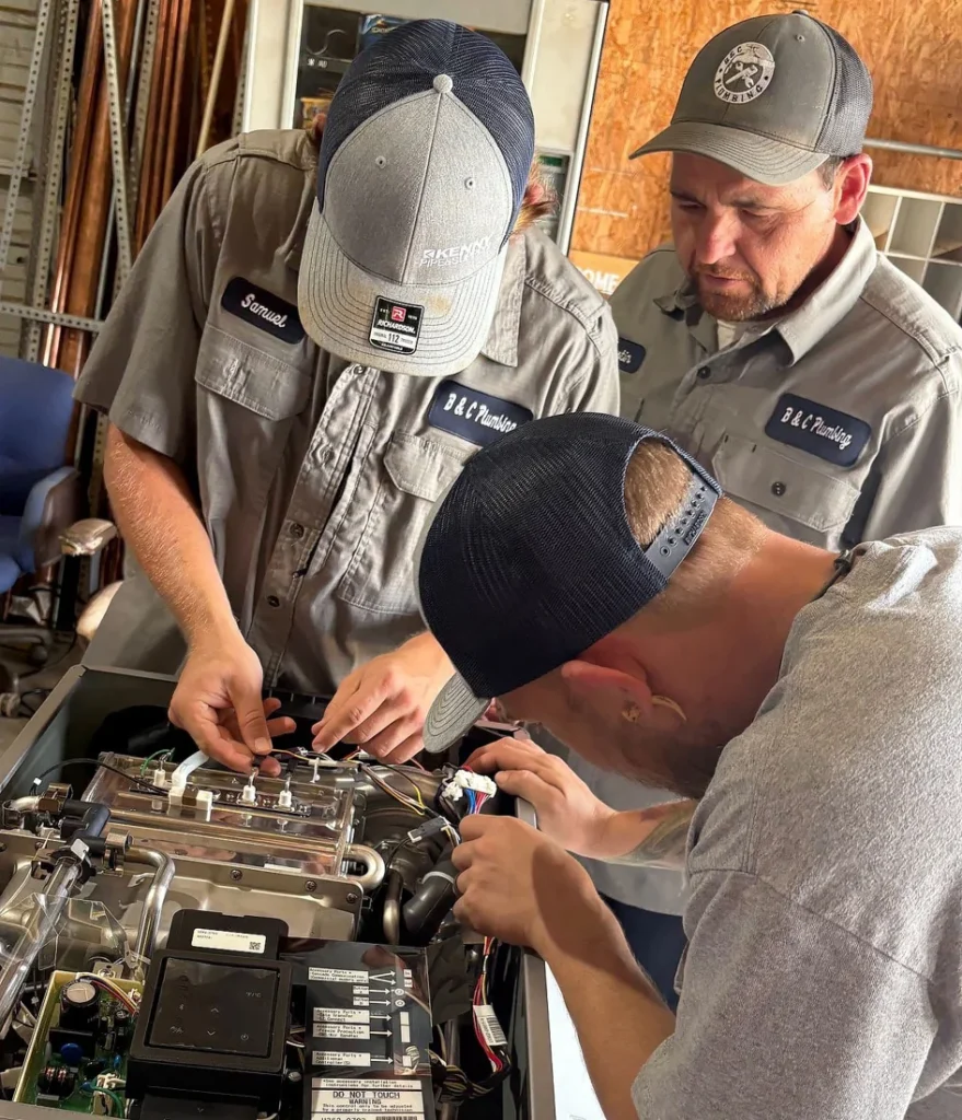 Licensed plumbers from B & C Plumbing receiving professional training for water heater installation in Huntsville, Alabama